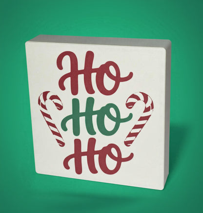 Ho Ho Ho Christmas sign with candy cane detail on green background – tiered tray decor, made in USA