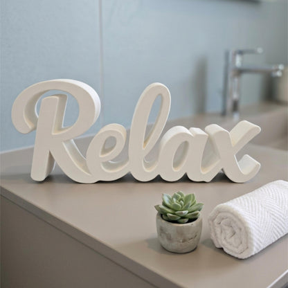 White Relax sign on bathroom counter with plant and towel – spa shelf decor, made in USA