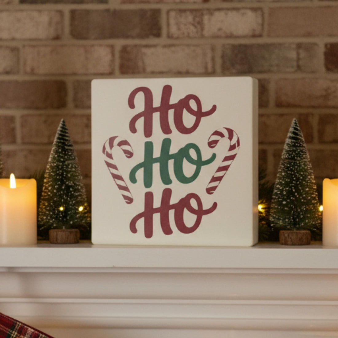Ho Ho Ho Christmas sign on fireplace mantel with holiday decor – made in USA